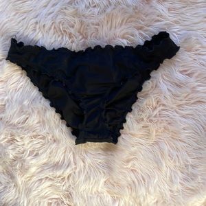 Never worn before black scrunchie bathing suit bottoms. SIZE LARGE.